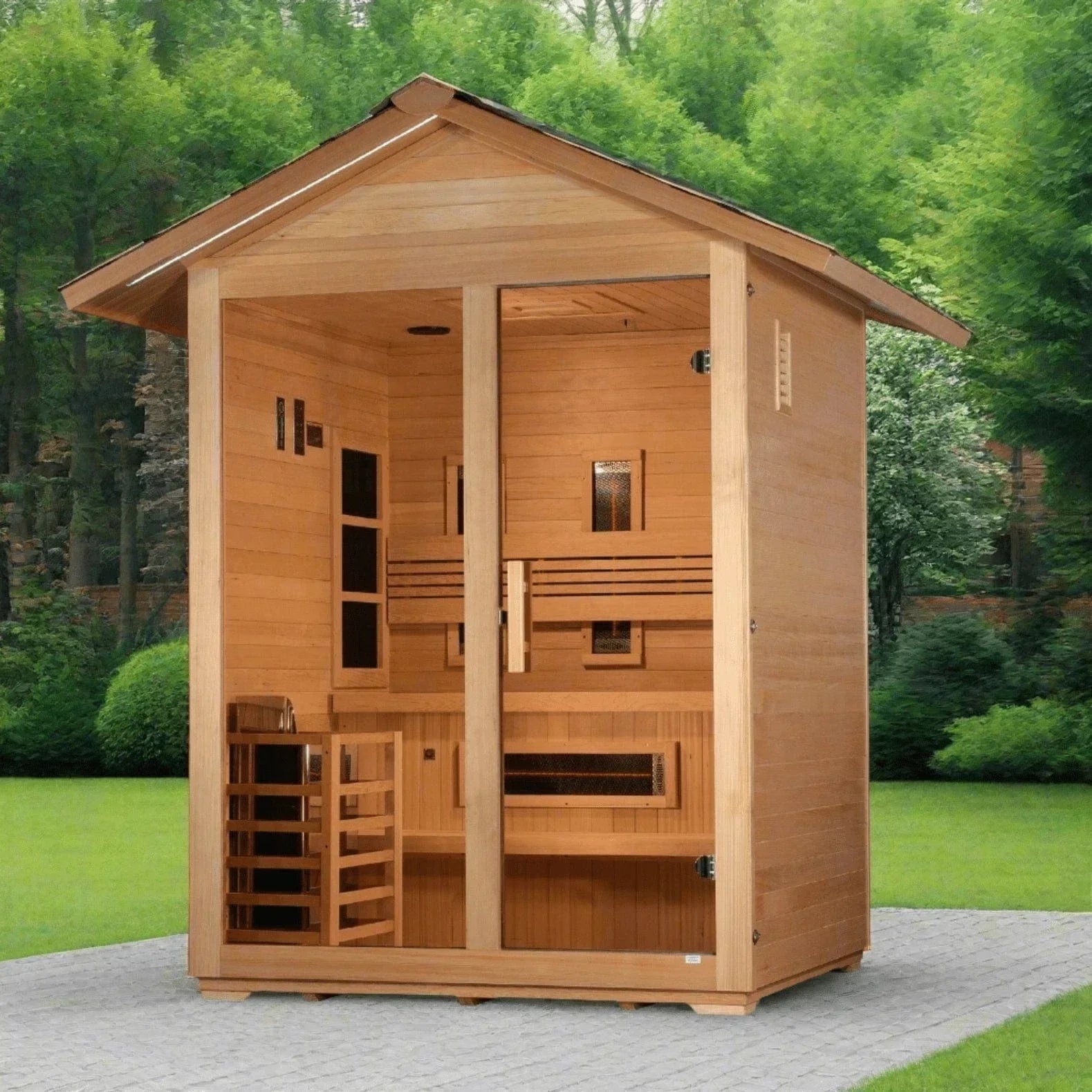 Golden Designs Carinthia 3-person hybrid traditional and infrared outdoor sauna installed on a modern stone patio next to a garden.