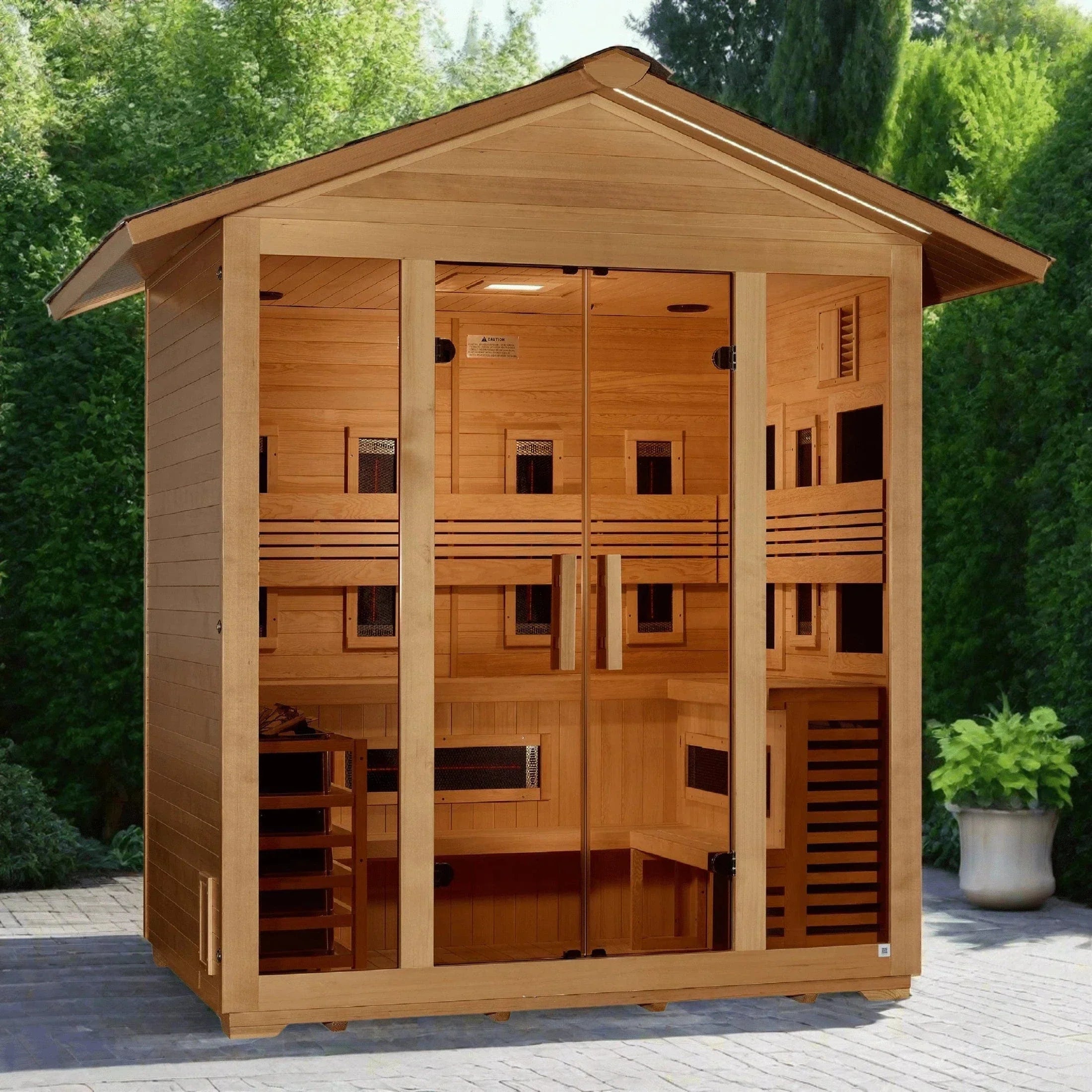 Golden Designs Gargellen hybrid outdoor traditional and infrared sauna installed on a modern backyard wooden deck.
