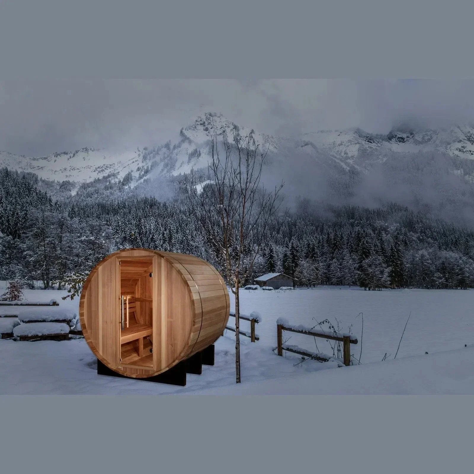Compact outdoor barrel sauna for two people by Golden Designs St. Moritz featuring traditional wood heating and cedar construction