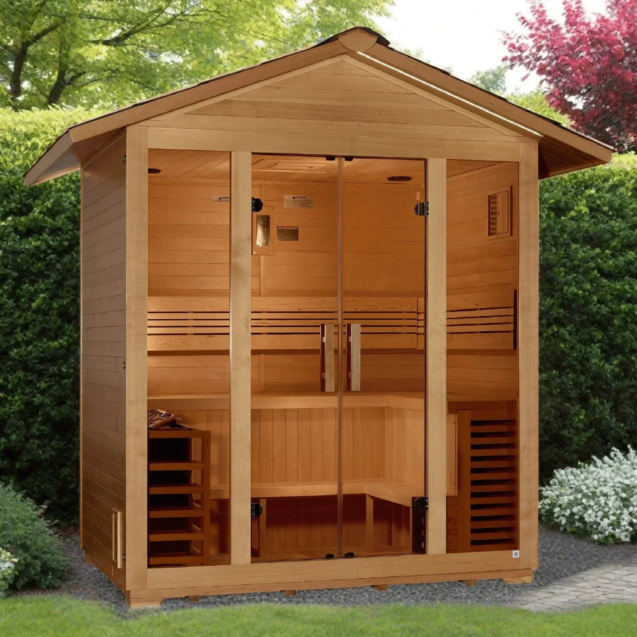 Golden Designs Vorarlberg 5-person traditional outdoor sauna beautifully installed on a modern stone patio next to a luxury backyard pool deck.