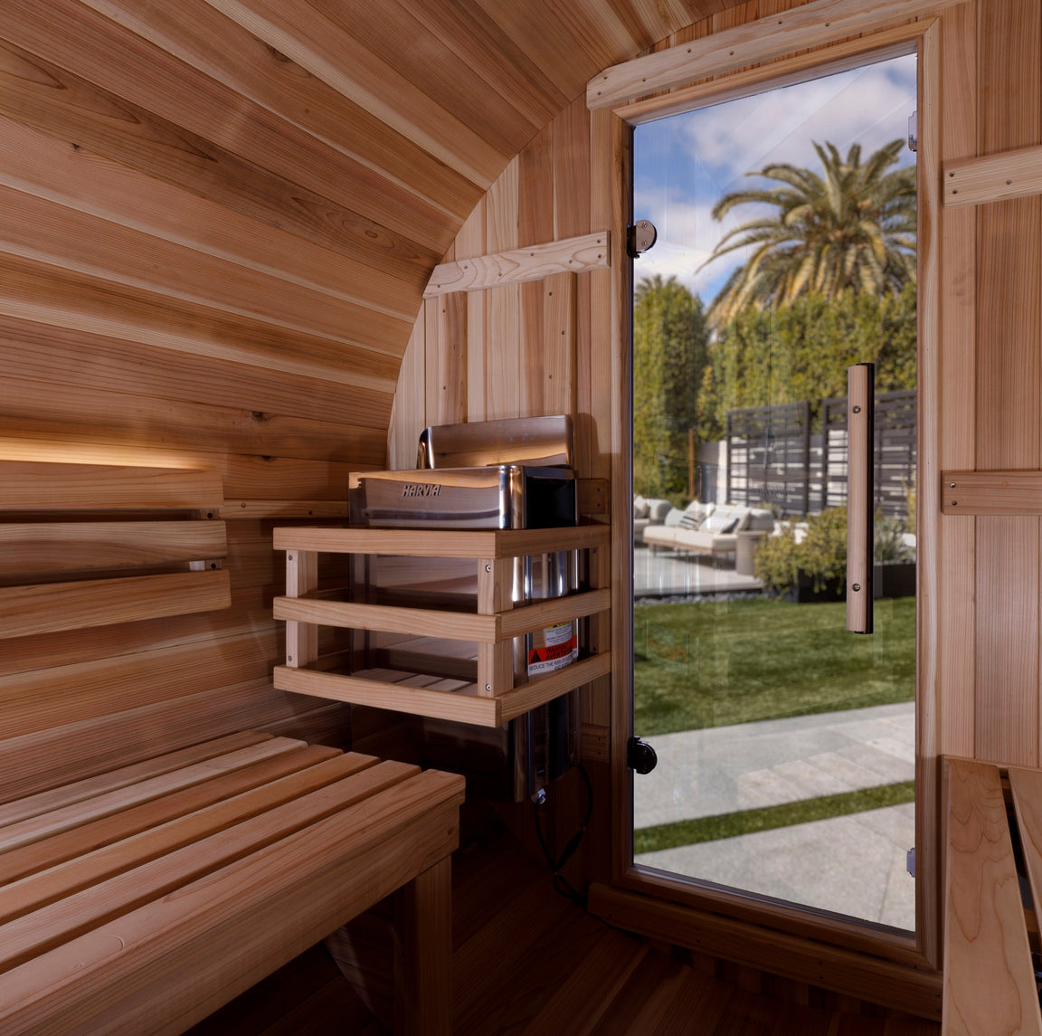 Golden Designs Zurich barrel traditional sauna designed for four users with durable wood craftsmanship and modern outdoor appeal.