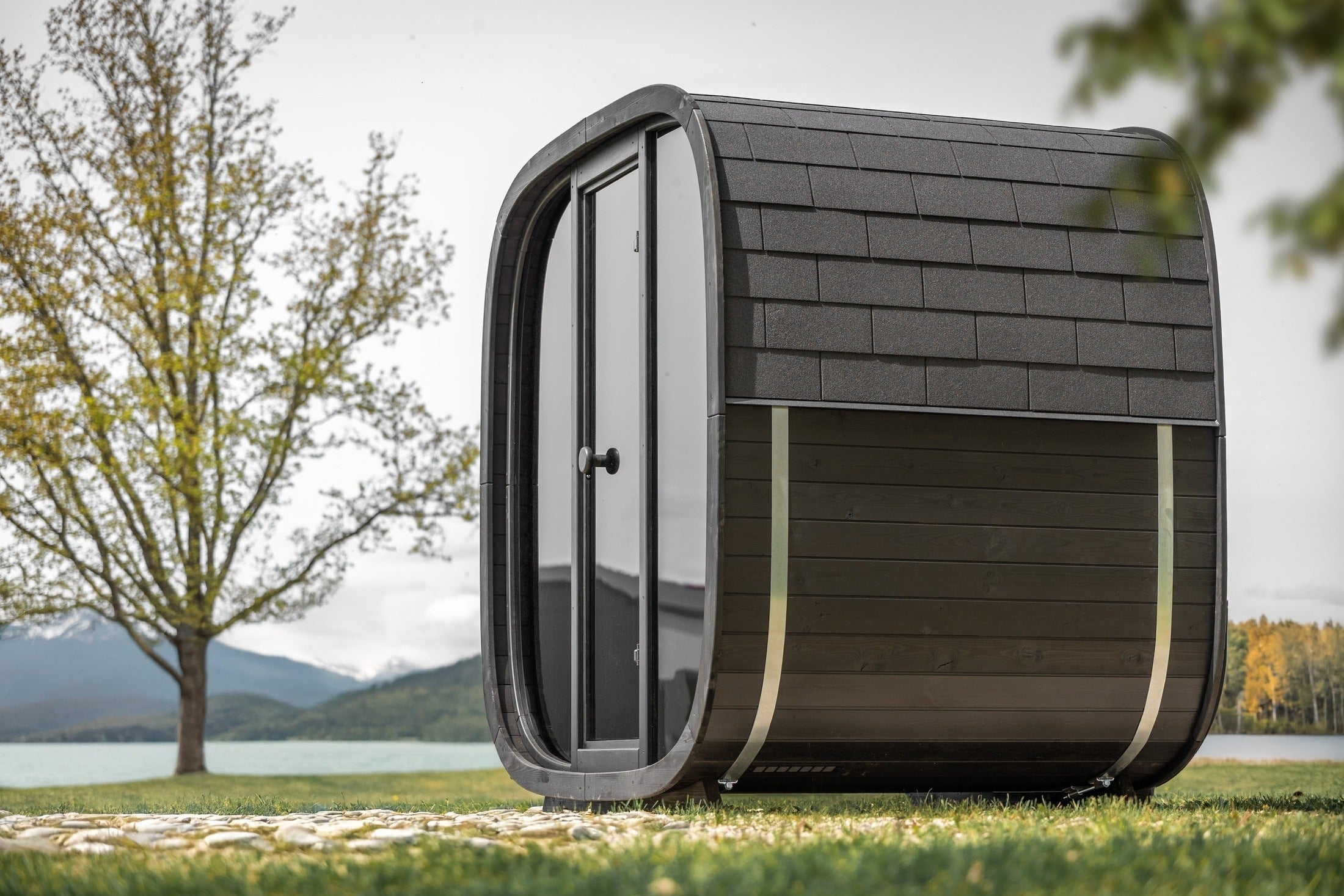 Luxury Leil Black Cube outdoor wood sauna cabin for 4 people, contemporary Thermowood sauna with alder interior and panoramic smoked glass front
