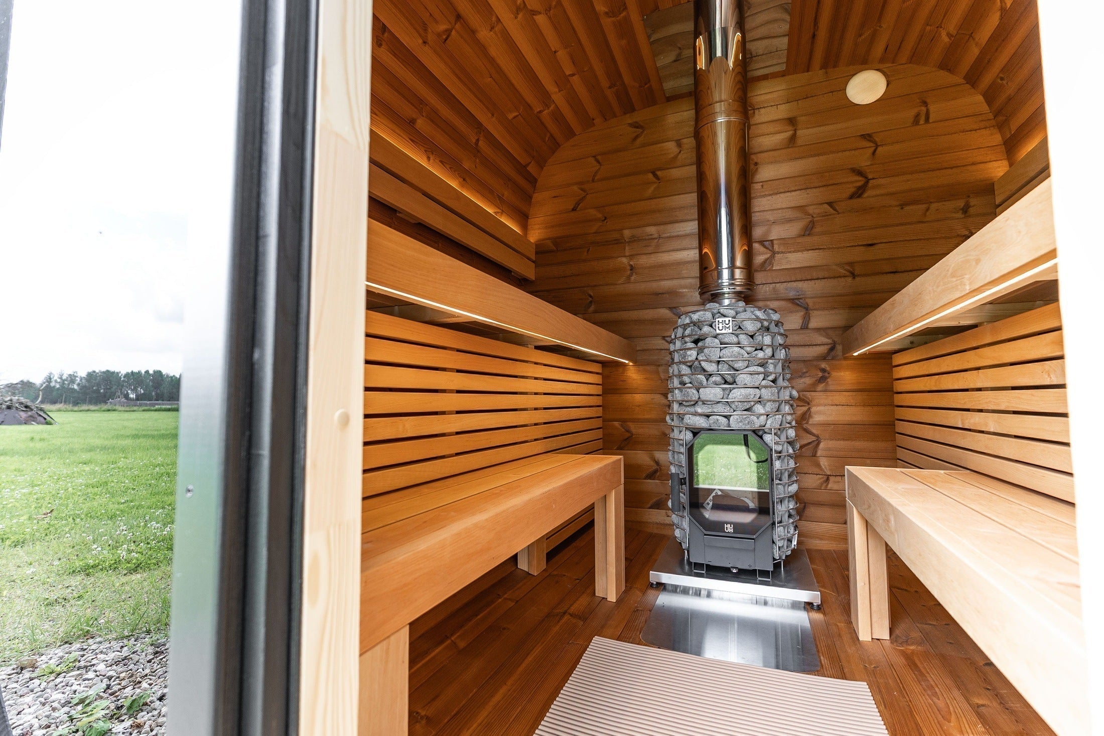 Modern ThermoWood outdoor sauna by Leil featuring Black Cube Comfort design and generous space for up to six bathers