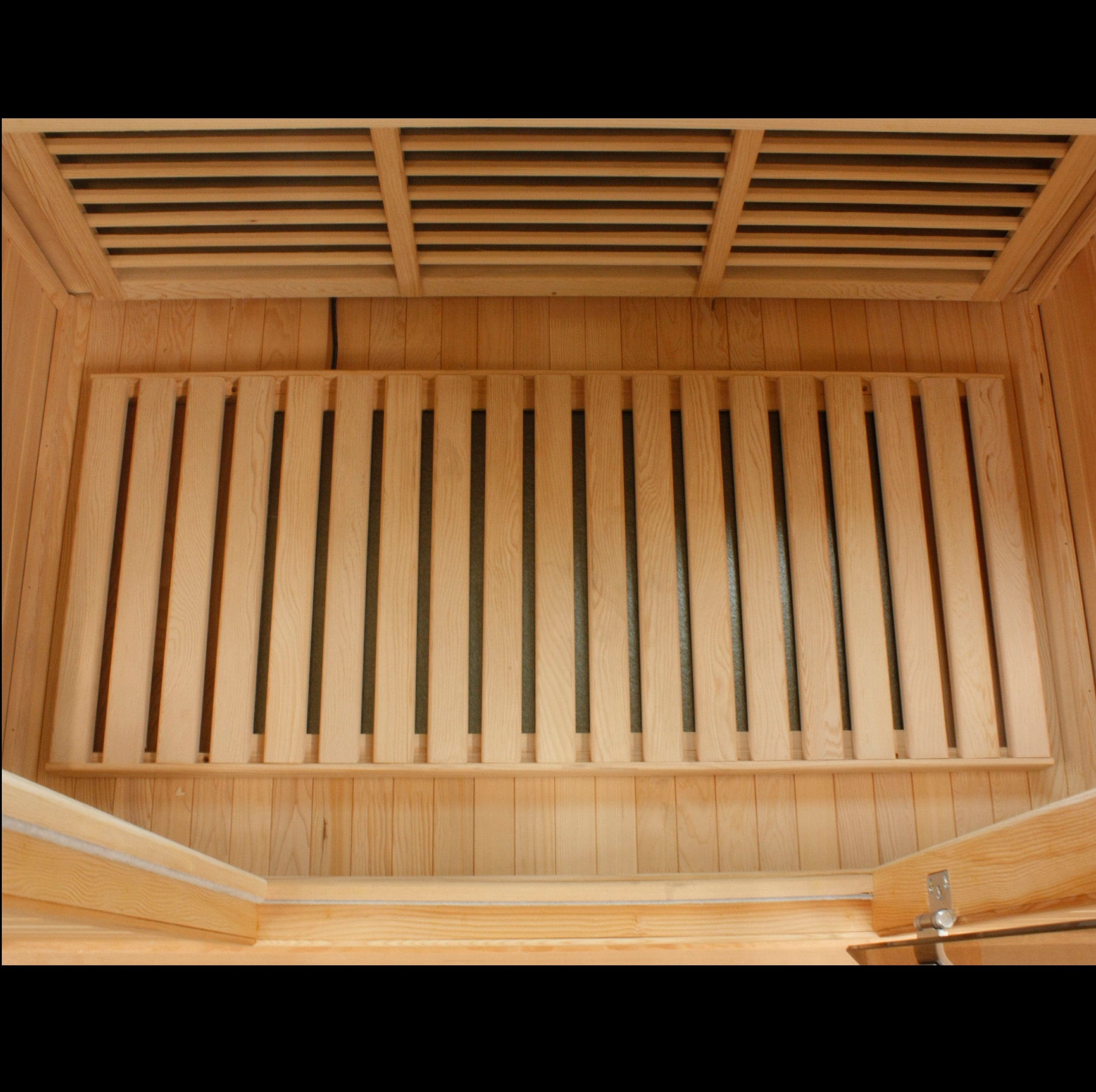 Maxxus 4-person low EMF far infrared sauna with Canadian hemlock wood interior, chromotherapy lighting, and glass door design for full home spa experience