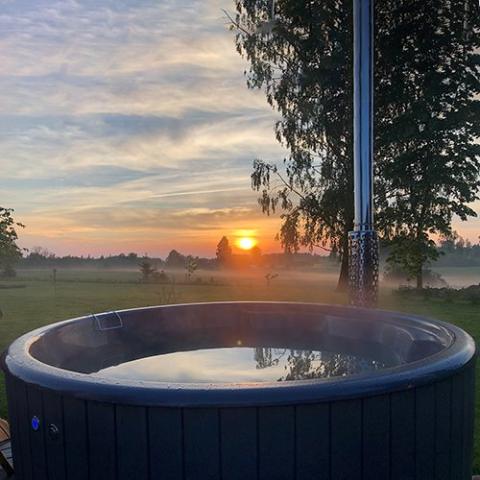 SaunaLife Model S4 outdoor wood-fired hot tub durable handcrafted wooden spa with efficient wood-burning heater for outdoor bathing and hydrotherapy