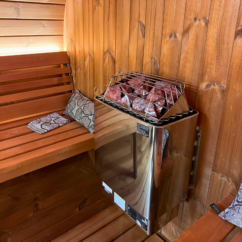 SaunaLife E6W outdoor barrel sauna with window, modern ergonomic barrel design, premium wood construction for luxury garden sauna experience