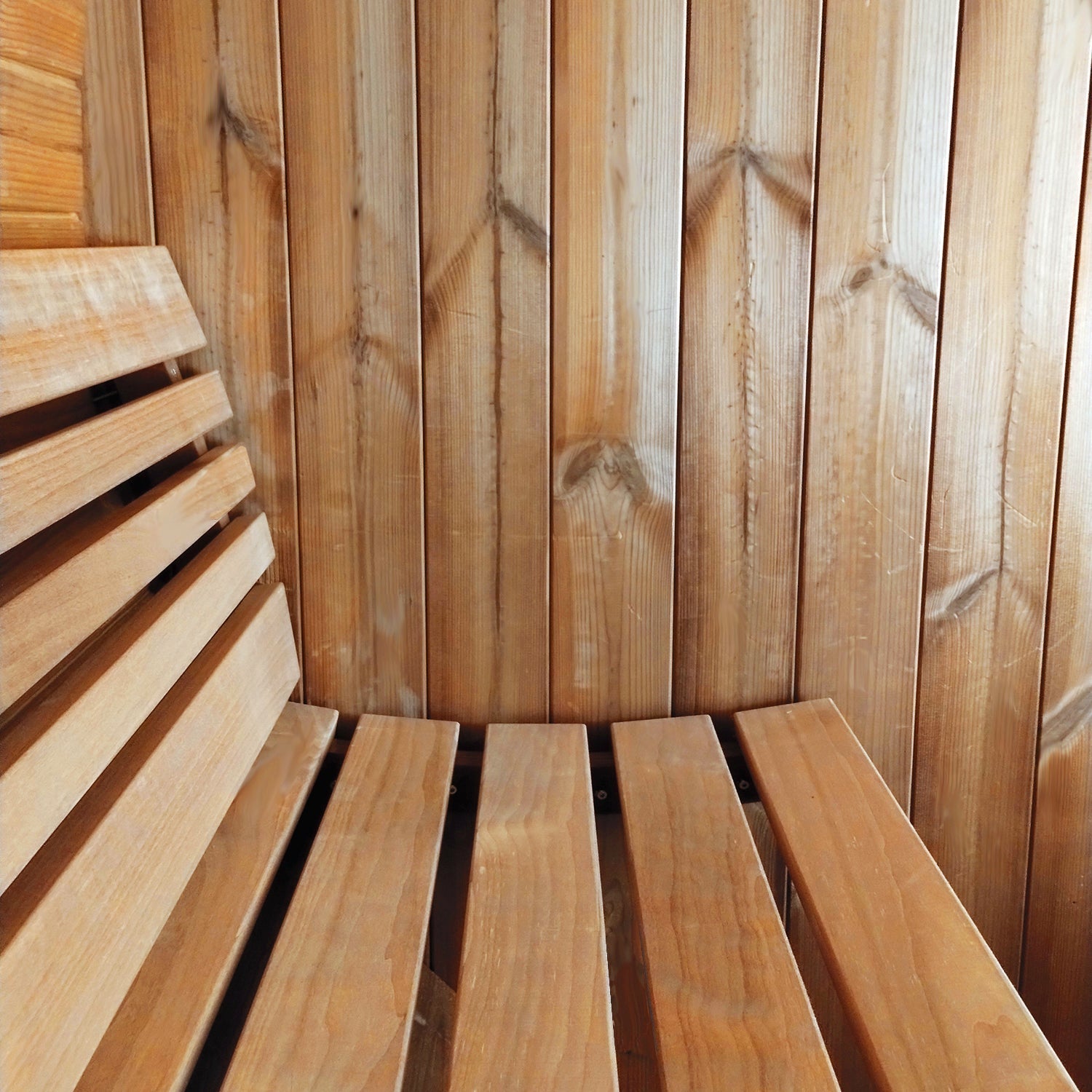 SaunaLife Model E8 ERGO-Series outdoor barrel sauna with ergonomic seating design, premium wood construction for backyard wellness