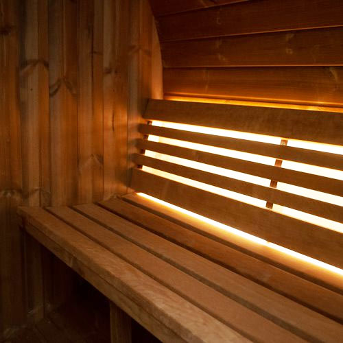 Outdoor SaunaLife Model E8 barrel sauna ERGO-Series, premium backyard sauna with curved ergonomic design and natural timber finish