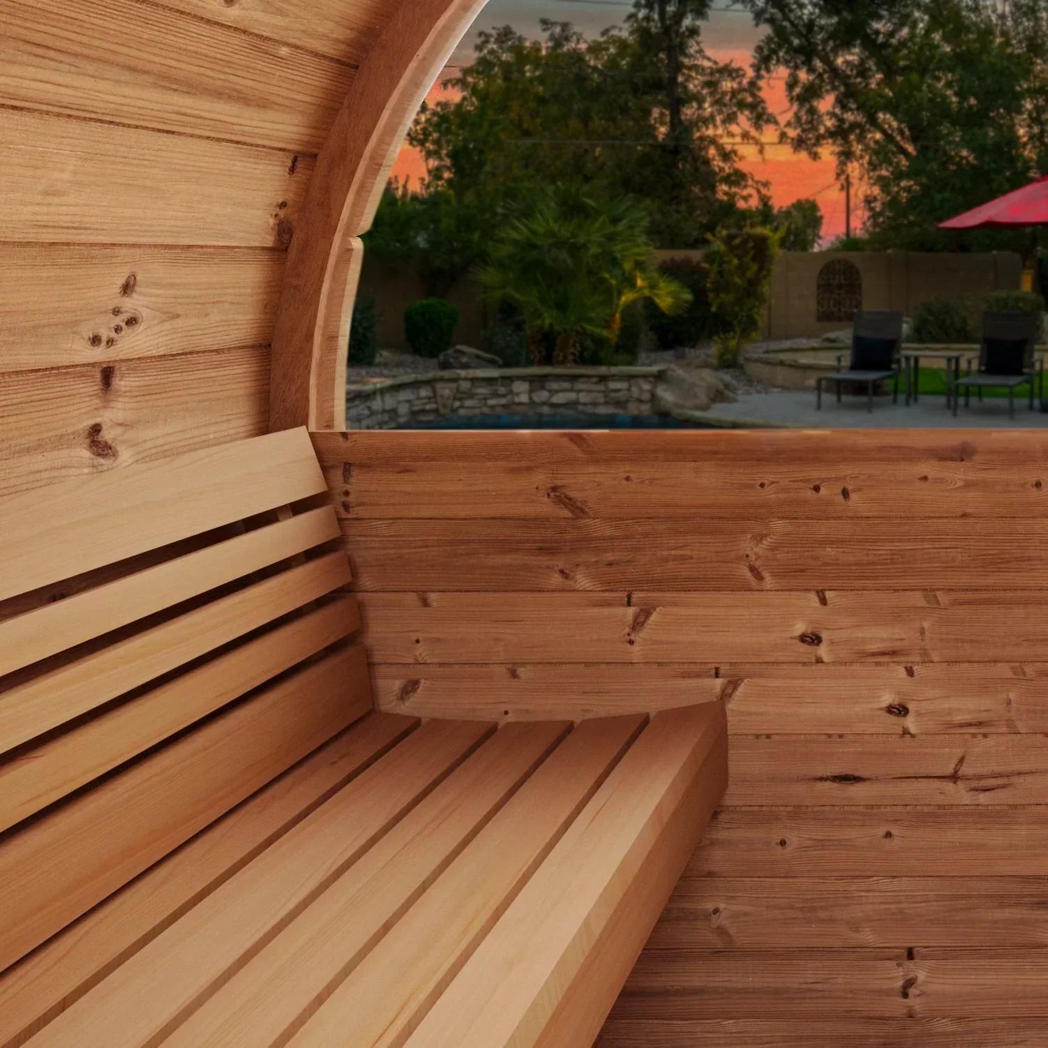 6-person SaunaLife E8W barrel sauna with panoramic rear window, ergonomic curved benches, and durable Thermo-Spruce luxury design