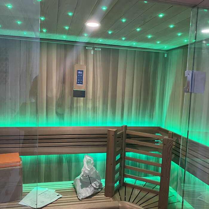 Golden Designs 3-person cedar sauna cabin with Harvia heater system offering powerful heat and relaxing home spa environment