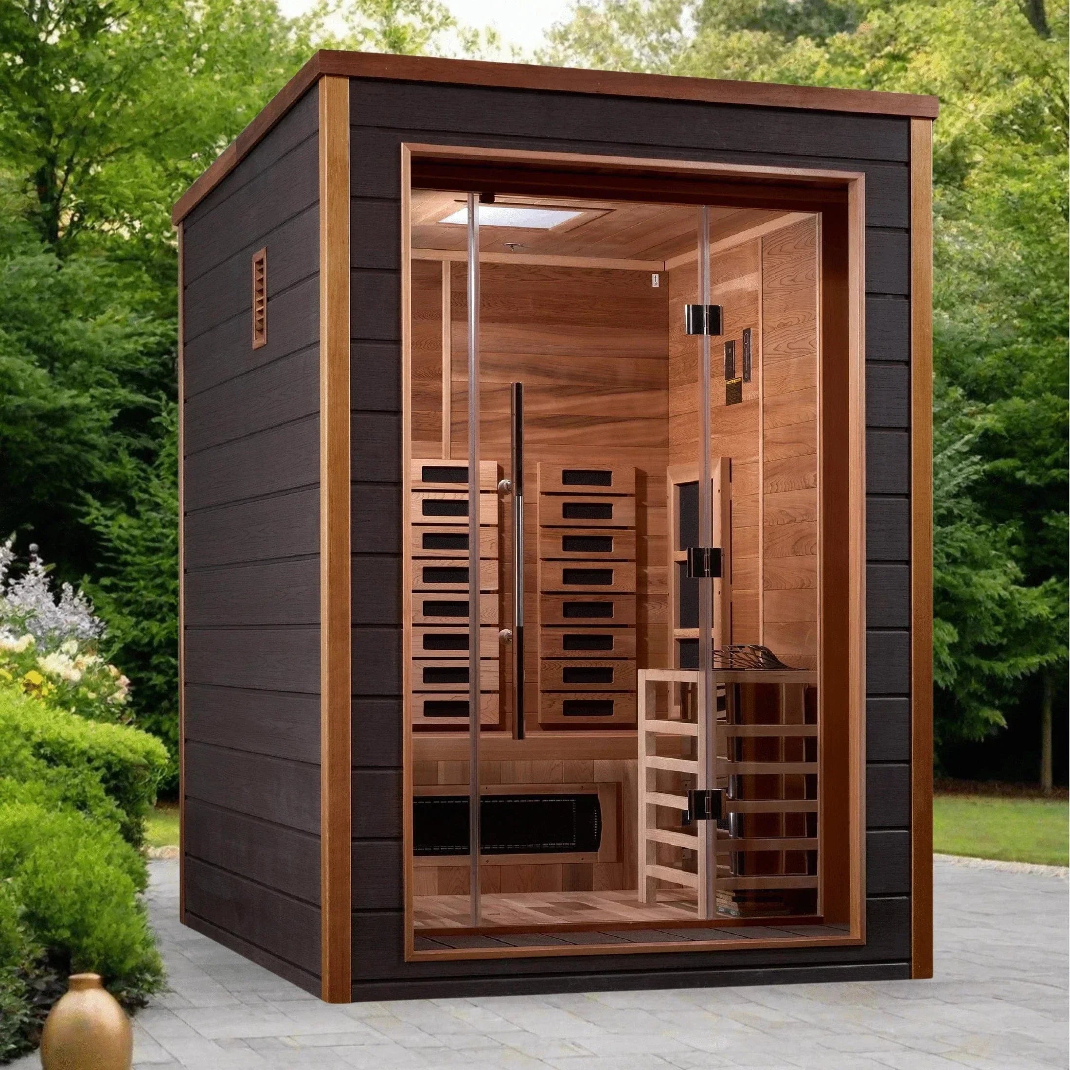 Golden Designs Nora 2-person hybrid traditional and infrared outdoor sauna perfectly installed on a modern residential patio deck.