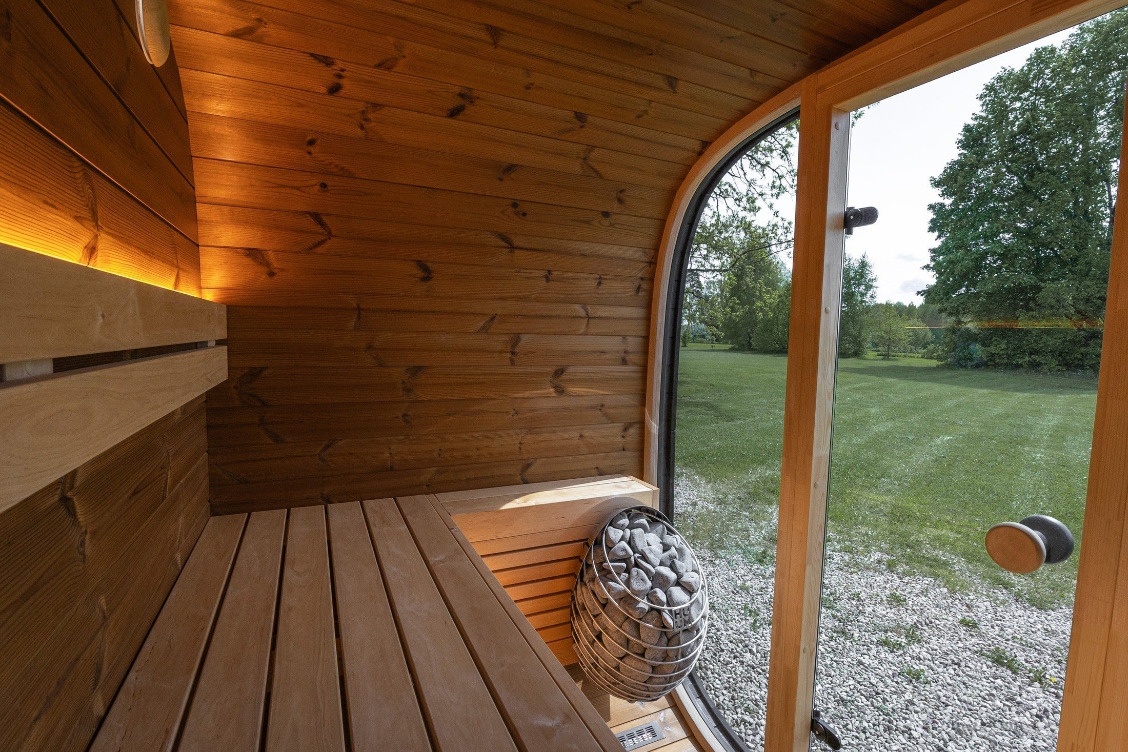 Leil Black Cube Classic 4-person outdoor sauna, modern Scandinavian-inspired sauna cabin with black Thermowood exterior and luxury alder wood interior