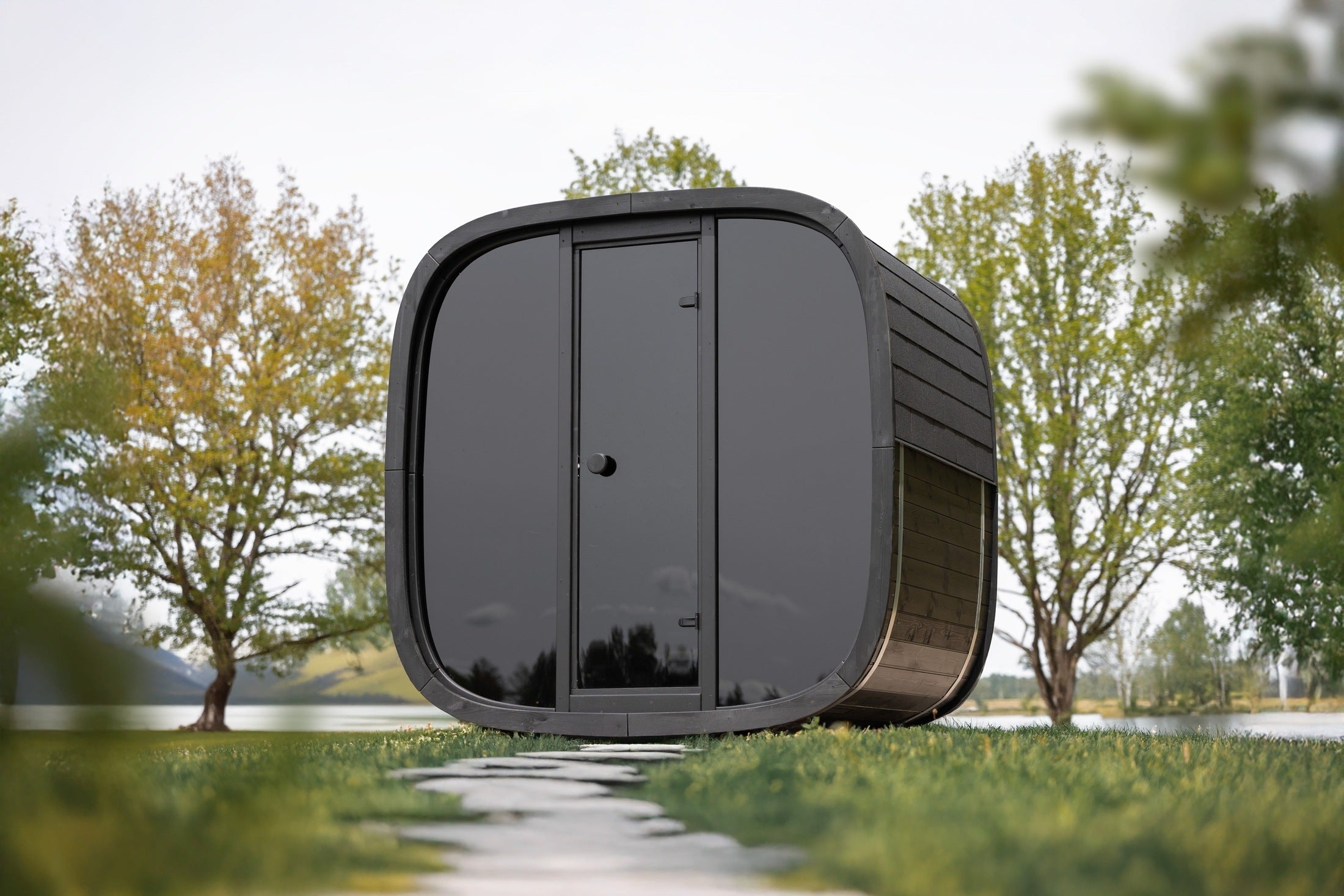 Leil Black Cube Classic premium outdoor sauna kit, sleek black cube design with Thermowood exterior, luxury backyard sauna for home spa experience