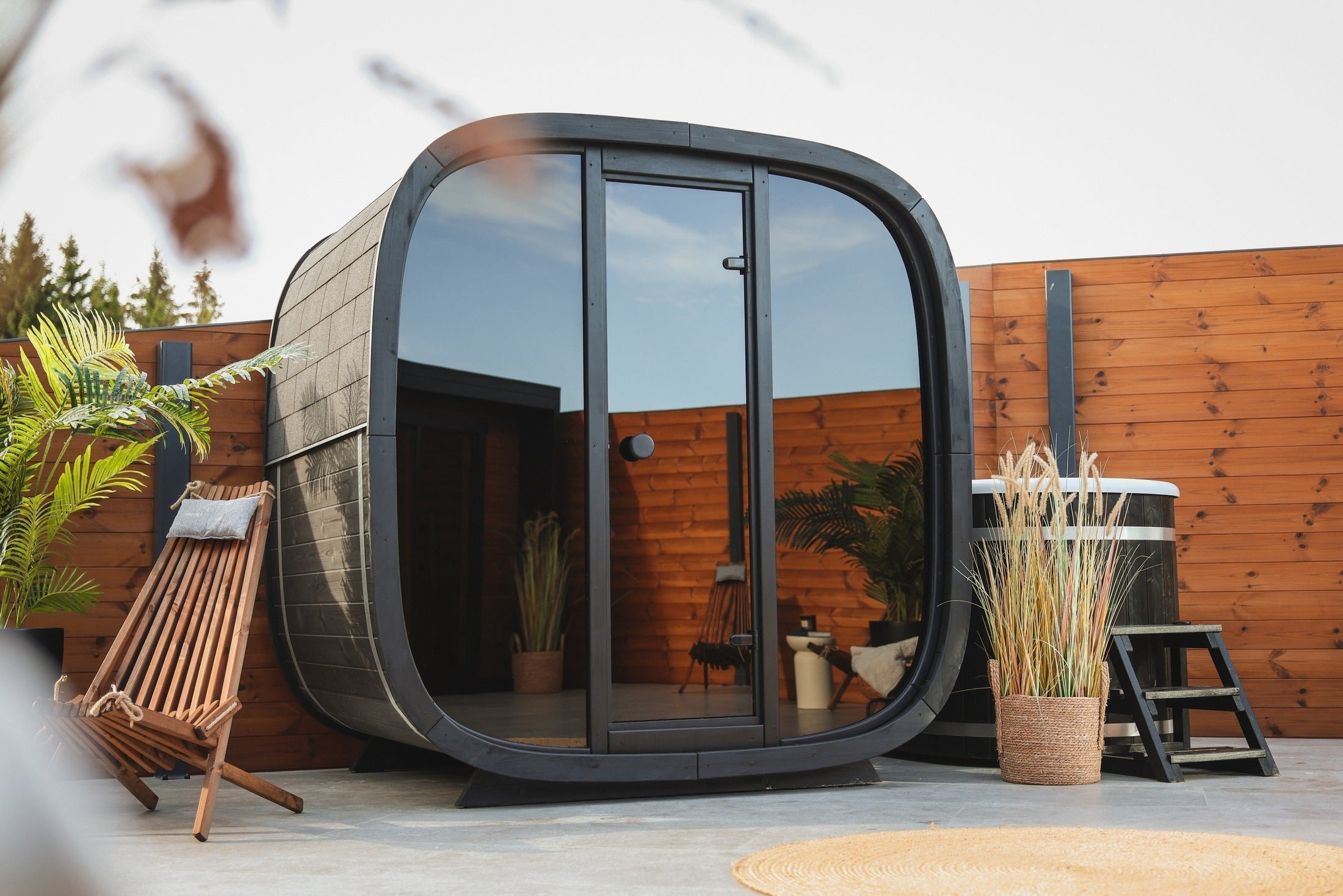 Leil Black Cube Classic outdoor wood sauna cabin for 4 to 5 people, luxury black Thermowood sauna with contemporary design and tempered glass entrance SASE-BC-5