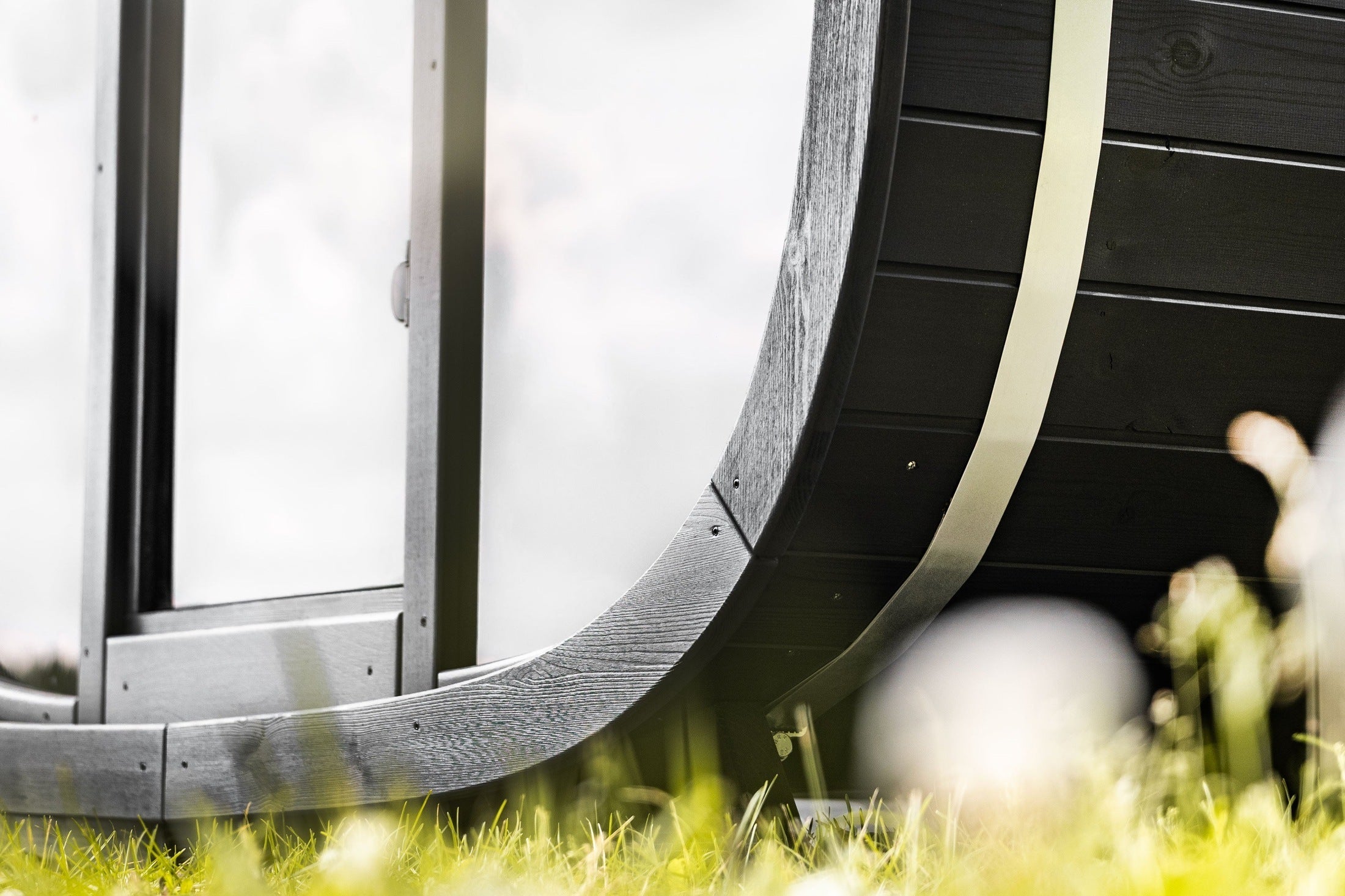 Luxury Leil Black Cube Comfort Outdoor Sauna for 6 people featuring premium ThermoWood construction and modern backyard wellness styling