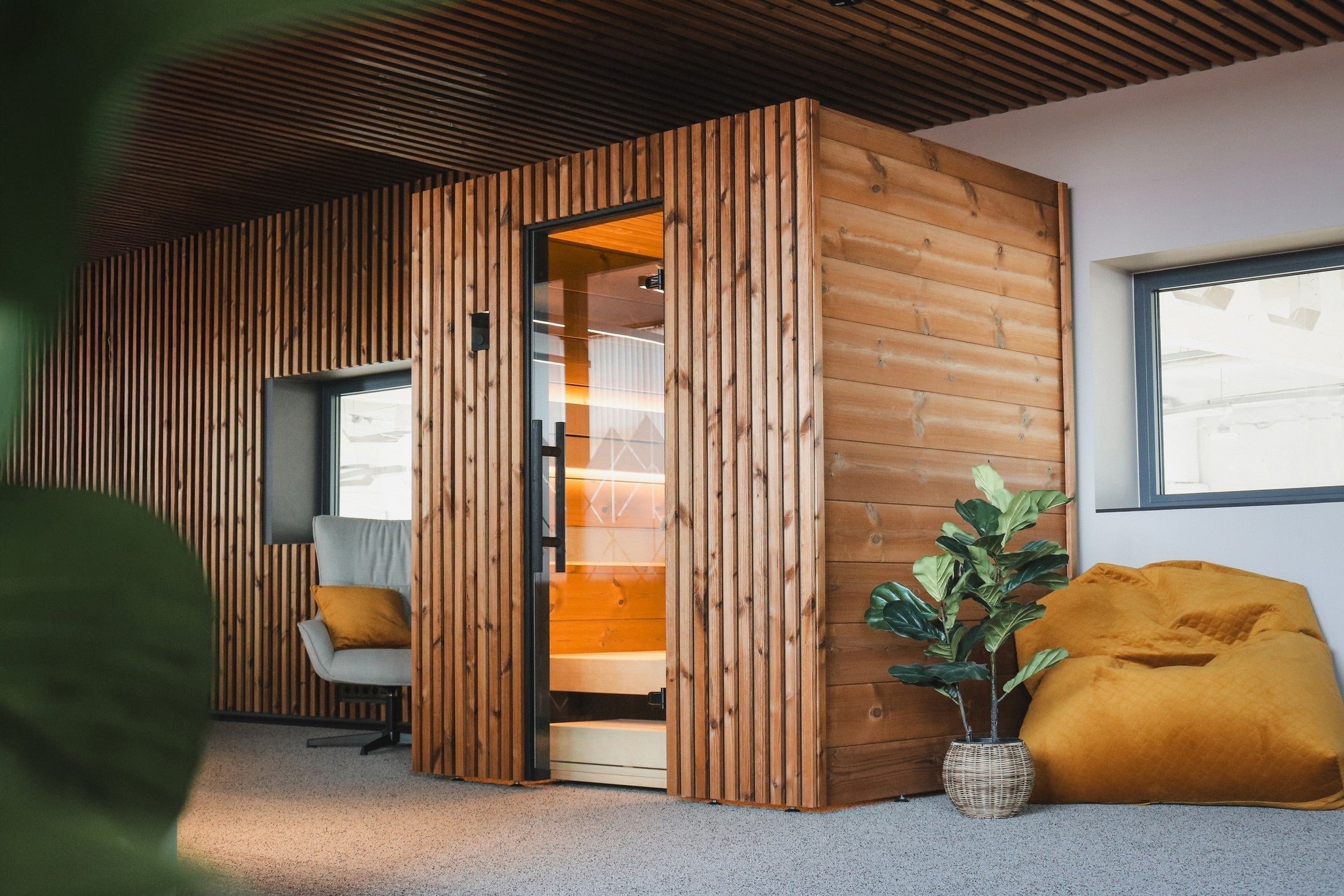 Leil Como 4-180 luxury indoor sauna for 4 people featuring ThermoWood® construction and multi-level bench seating