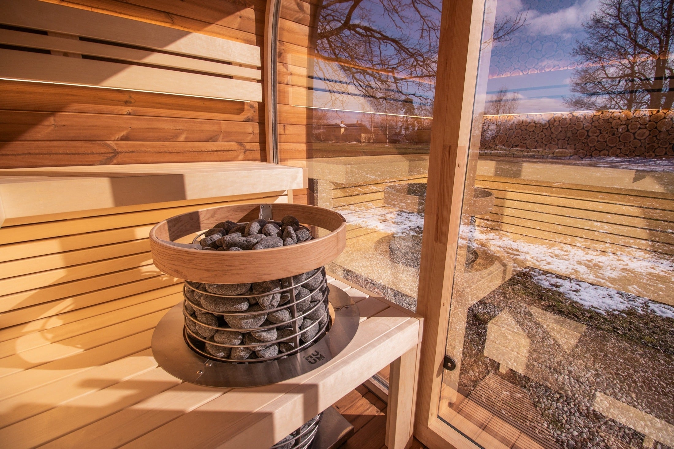 Premium 6 person outdoor round cube sauna cabin by Leil Relax, crafted in ThermoWood with spacious U-shaped seating for deep relaxation experience