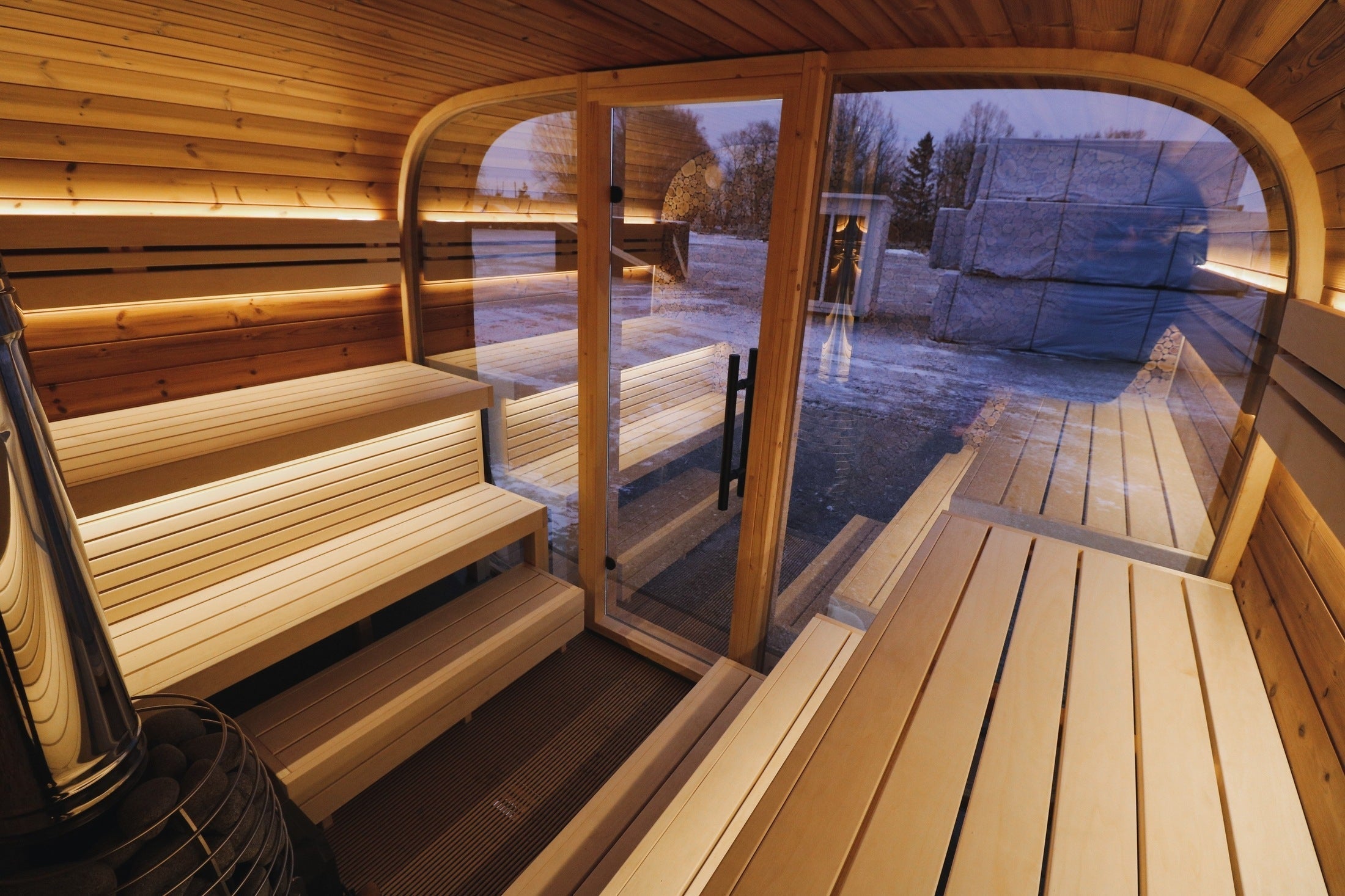 Outdoor 6-8 person sauna Leil Round Cube ThermoWood®, modern Nordic wellness cabin designed for backyard spa and relaxation
