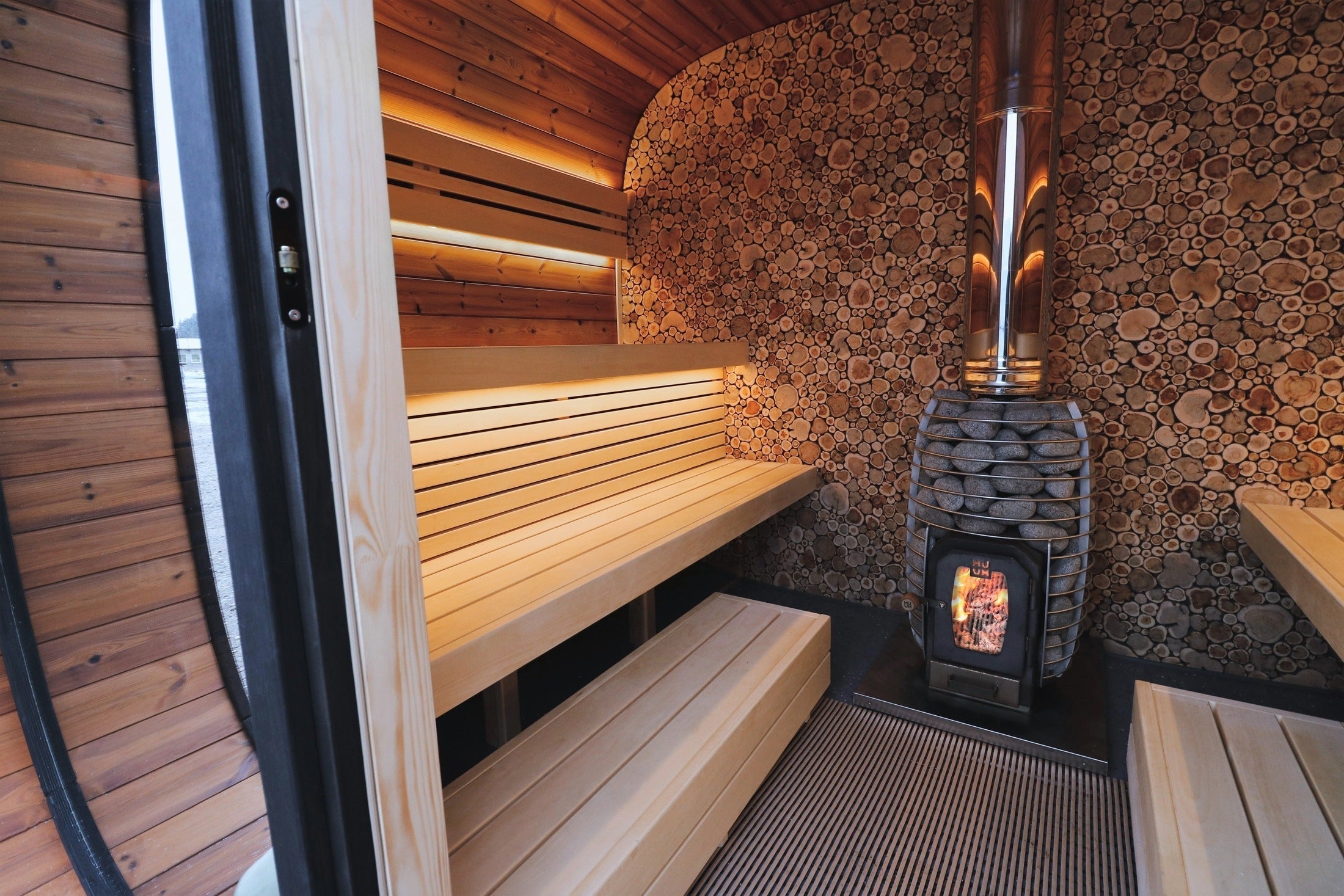 Spacious 6-8 person outdoor sauna Leil Round Cube made with ThermoWood®, modern Scandinavian backyard wellness sauna with premium design