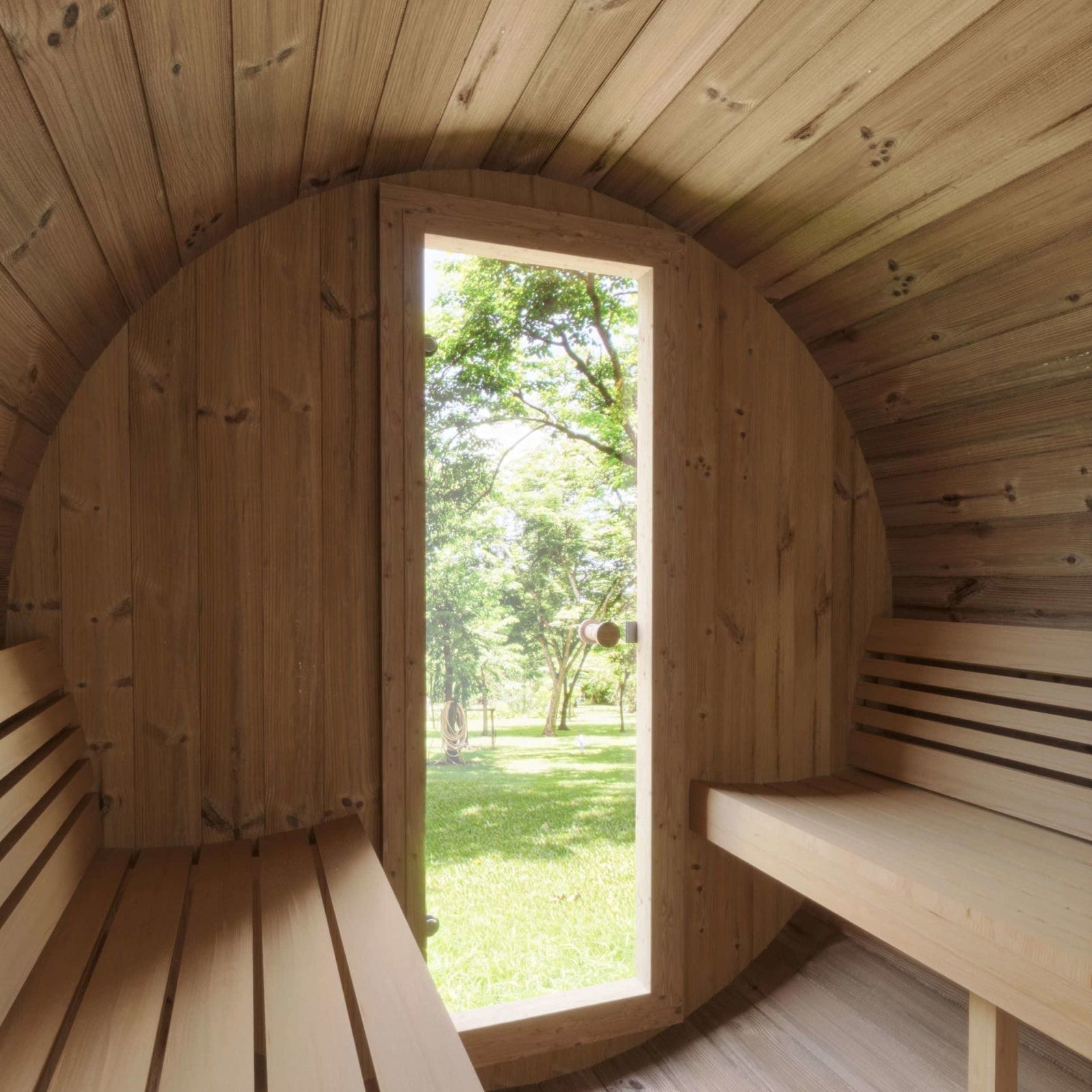 Luxury SaunaLife E7 barrel sauna made with Thermo-Spruce wood, arched ergonomic backrest, and tempered bronze glass for modern outdoor relaxation
