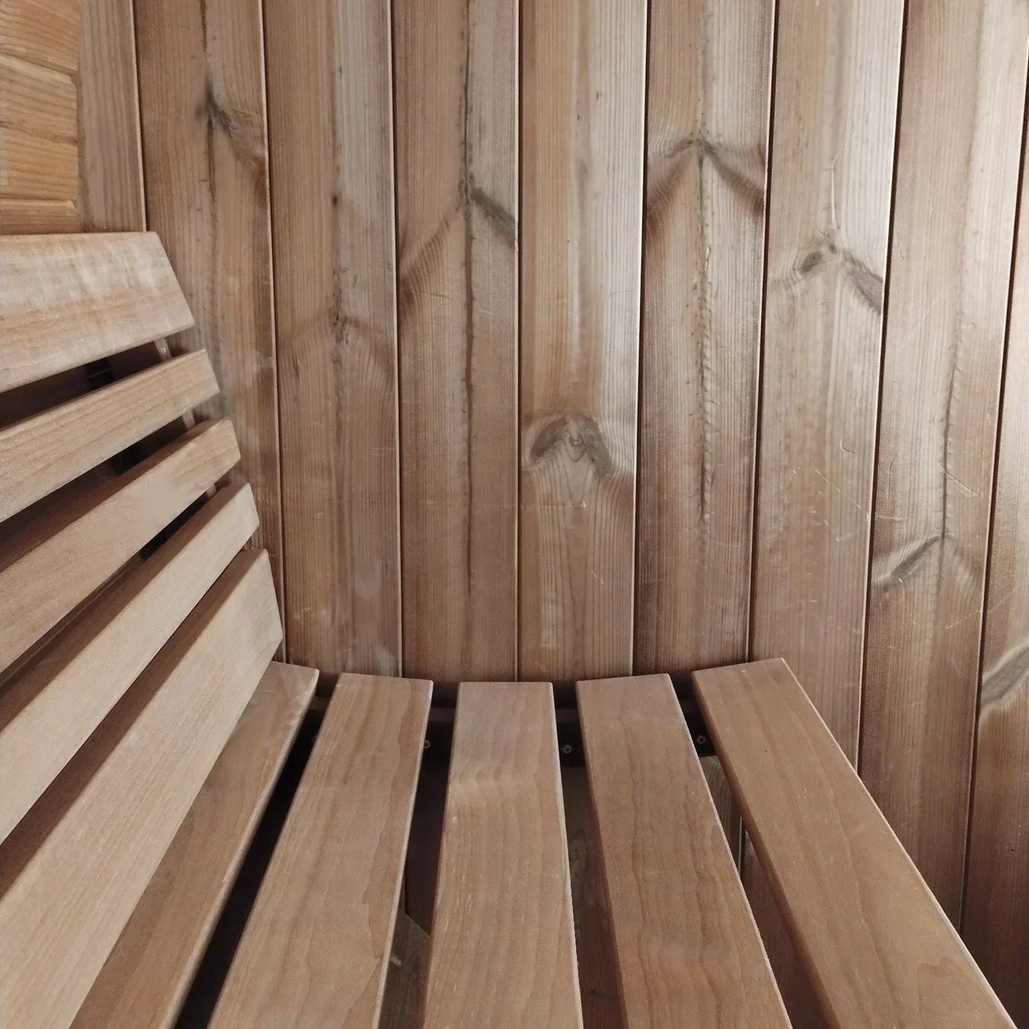 6-person SaunaLife E8W Barrel Window Sauna made from durable Thermo-Spruce with curved Thermo-Aspen benches and ergonomic interior seating