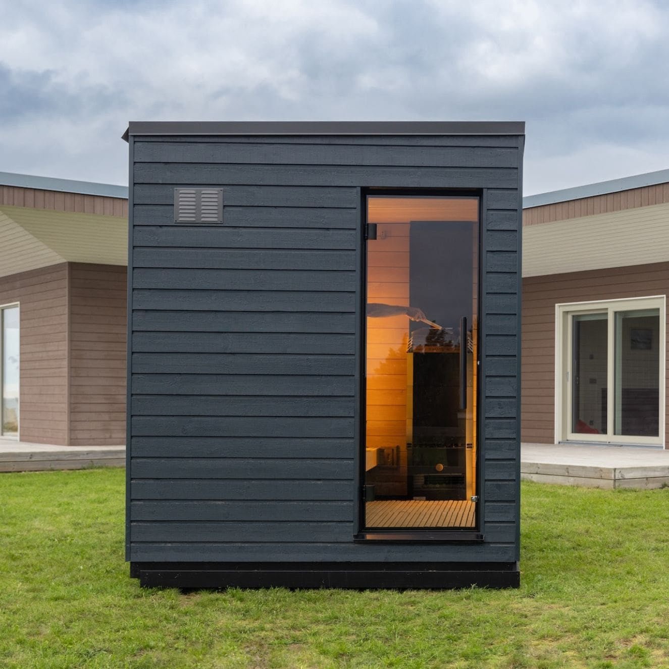 SaunaLife G6 Scandinavian outdoor sauna cabin with panoramic glass front, premium wood interior, and ready-to-use construction